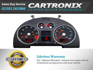 Audi TT dashboard instrument cluster with speedometer and warning lights displayed.