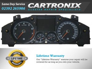 Dashboard cluster featuring speedometer, tachometer, and fuel gauge for vehicle instrumentation.