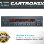 BMW radio unit with buttons and display, used for audio and onboard computer functions in vehicles.