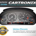 Instrument cluster of a BMW E39 5 Series showing speedometer, tachometer, and warning lights.