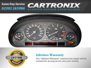 Instrument cluster of a BMW E39 5 Series showing speedometer, tachometer, and warning lights.