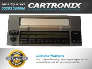 Range Rover radio control unit with buttons and display for audio functions.