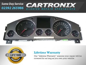 VW Phaeton instrument cluster dashboard with speedometer, tachometer, and digital display.