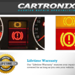 Dashboard warning lights display showing an alert symbol in yellow and red on an LCD screen.